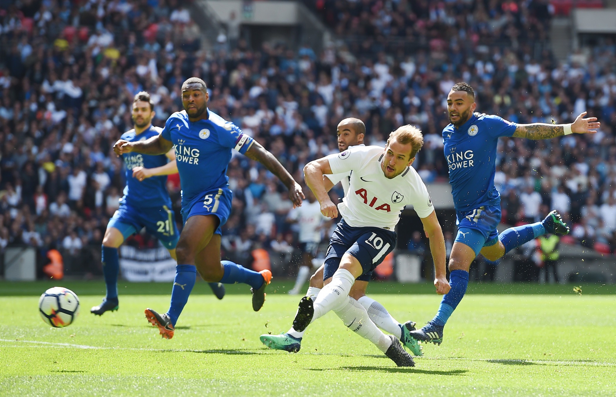 epa06733056 Tottenham's Harry Kane scores against Leicester City during an English Premier League soccer match at Wembley Stadium in London, Britain, 13 May 2018. EPA-EFE/ANDY RAIN EDITORIAL USE ONLY. No use with unauthorized audio, video, data, fixture lists, club/league logos or 'live' services. Online in-match use limited to 75 images, no video emulation. No use in betting, games or single club/league/player publications