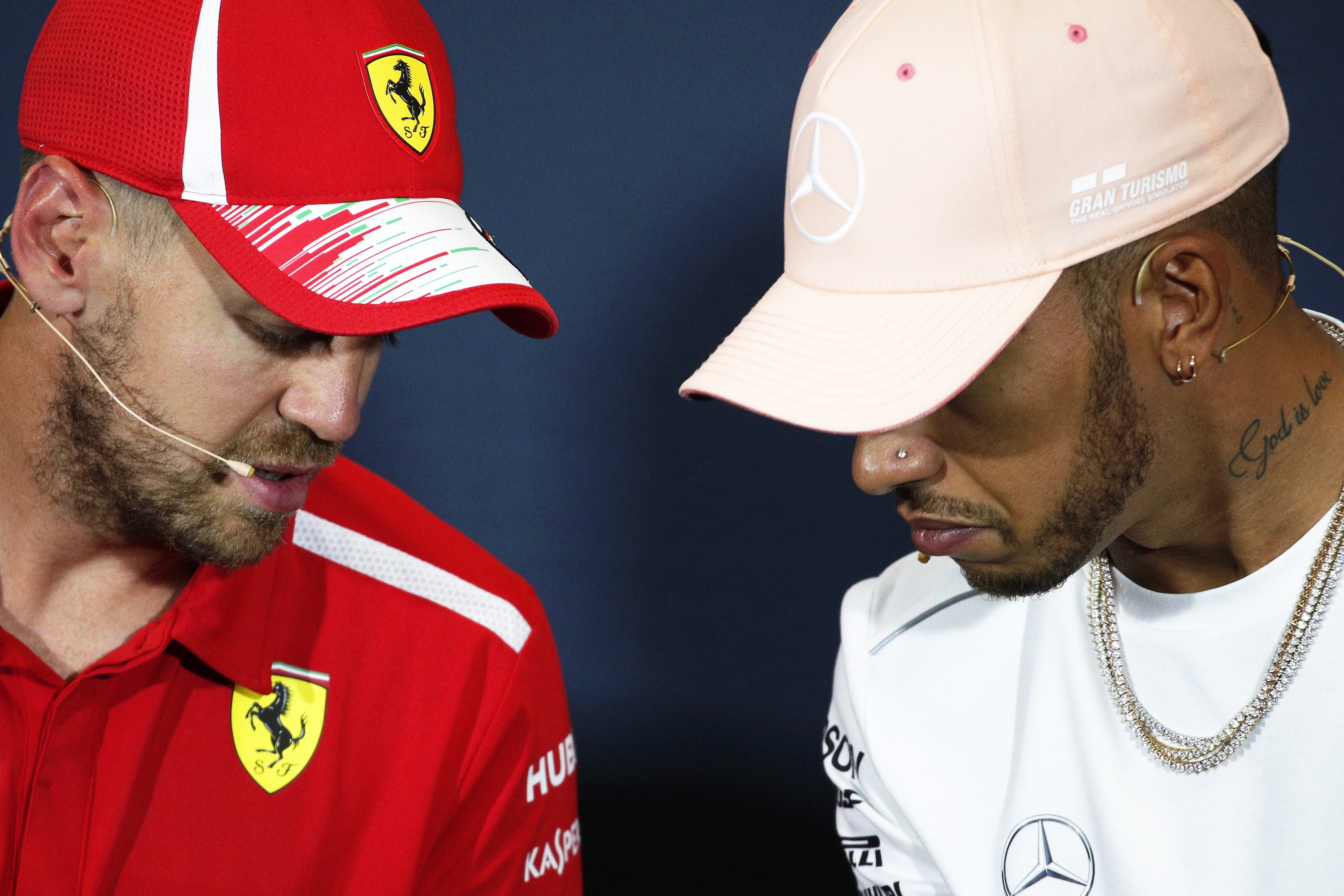 epa06757844 German Formula One driver Sebastian Vettel (L) of Scuderia Ferrari speaks with British driver Lewis Hamilton (R) of Mercedes AMG GP during a press conference at Monte Carlo circuit in Monaco, 23 May 2018. The 2018 Formula One Grand Prix of Monaco will take place on 27 May 2018. EPA-EFE/YOAN VALAT
