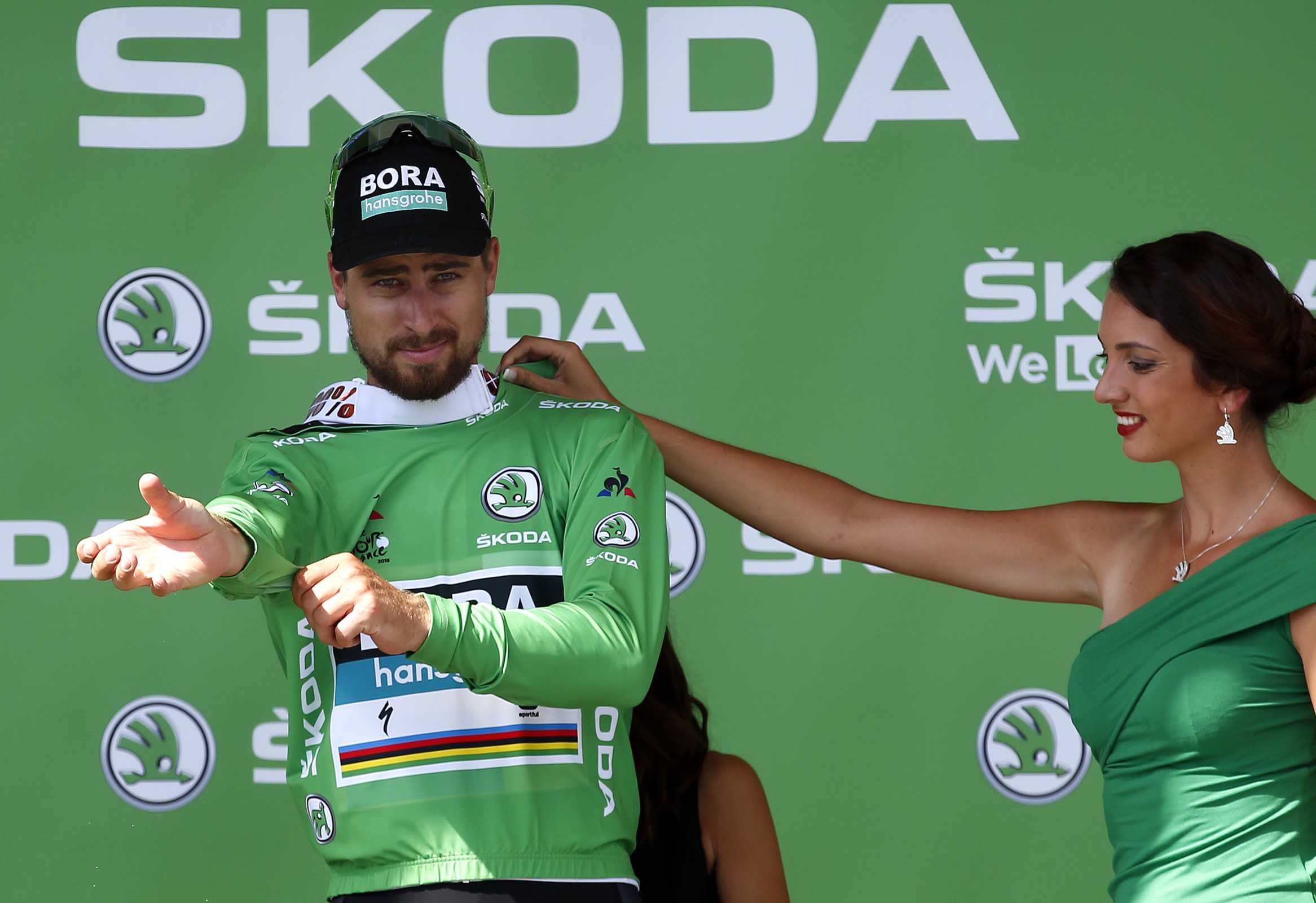epa06880910 Bora Hansgrohe team rider Peter Sagan of Slovakia celebrates on the podium wearing the best sprinter green jersey following the 5th stage of the 105th edition of the Tour de France cycling race over 204,5km between Lorient and Quimper, France, 11 July 2018. EPA-EFE/SEBASTIEN NOGIER
