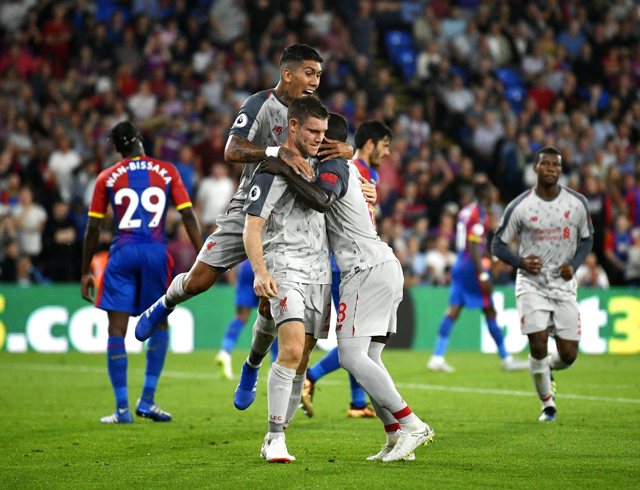 epa06960886 Liverpool's James Milner (C) celebrates after he scores during the English Premier League soccer match between Crystal Palace and Selhurst Park in London, Britain, 20 August 2018.
EDITORIAL USE ONLY. No use with unauthorized audio, video, data, fixture lists, club/league logos or 'live' services. Online in-match use limited to 75 images, no video emulation. No use in betting, games or single club/league/player publications EPA-EFE/NEIL HALL