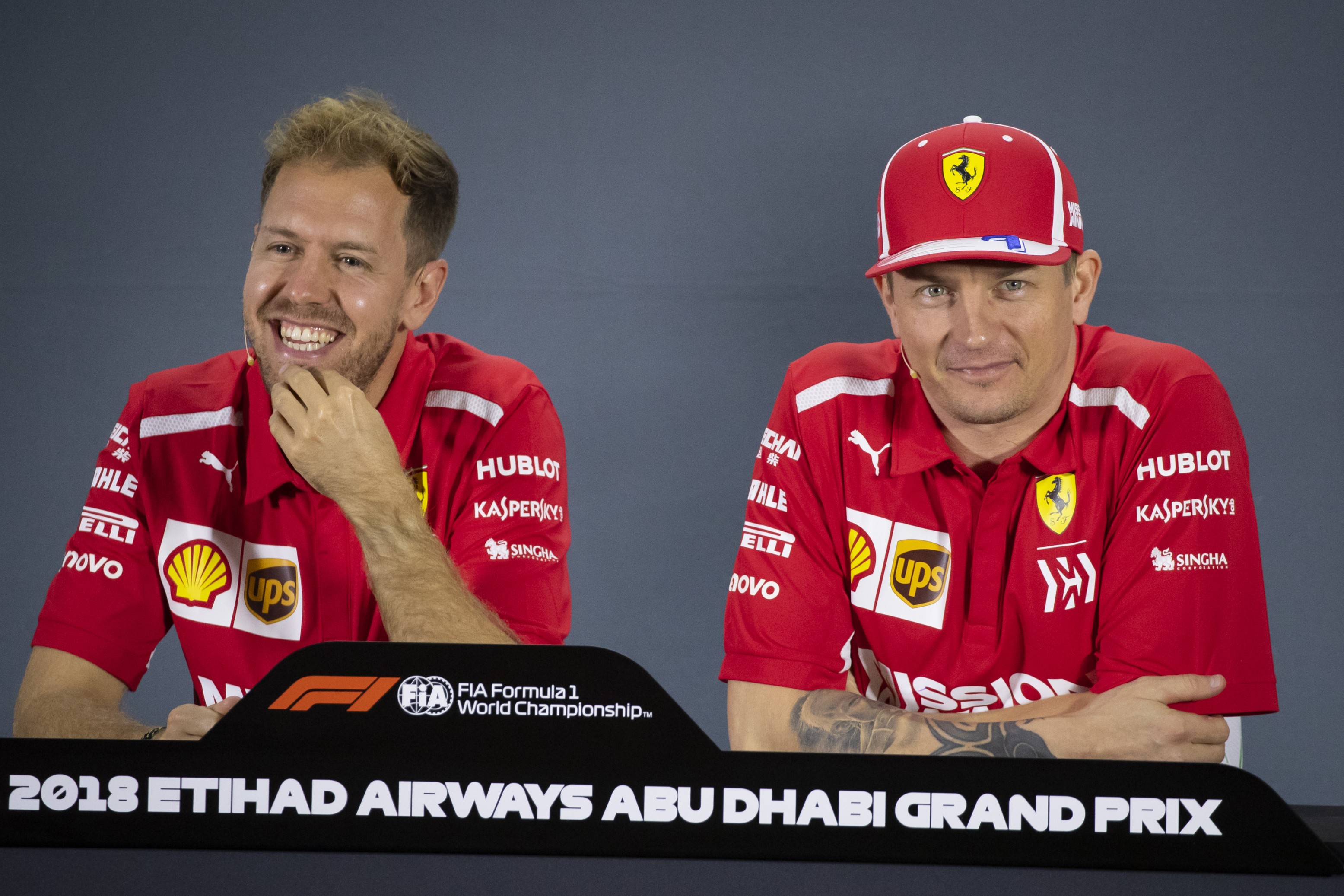 epa07182936 German Formula One driver Sebastian Vettel of Scuderia Ferrari (L) and teammate Finnish Formula One driver Kimi Raikkonen (R) attend a press conference ahead of the Abu Dhabi Formula One Grand Prix 2018 at Yas Marina Circuit in Abu Dhabi, United Arab Emirates, 22 November 2018. The Formula One Grand Prix of Abu Dhabi will take place on 25 November 2018. EPA-EFE/VALDRIN XHEMAJ