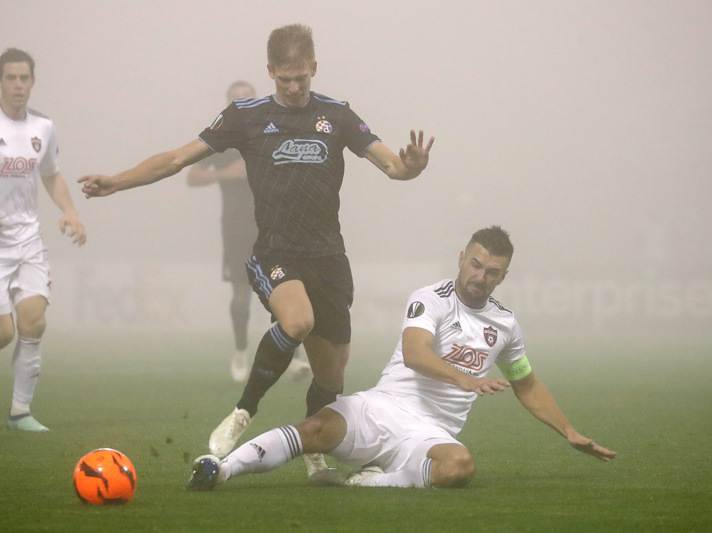 epa07152087 Spartak's Boris Godal (R) in action against Dinamo's Mario Gavranovic (L) during the UEFA Europa League' group D soccer match between FC Spartak Trnava and GNK Dinamo Zagreb at Maksimir stadium in Zagreb, Croatia, 08 November 2018. EPA-EFE/ANTONIO BAT