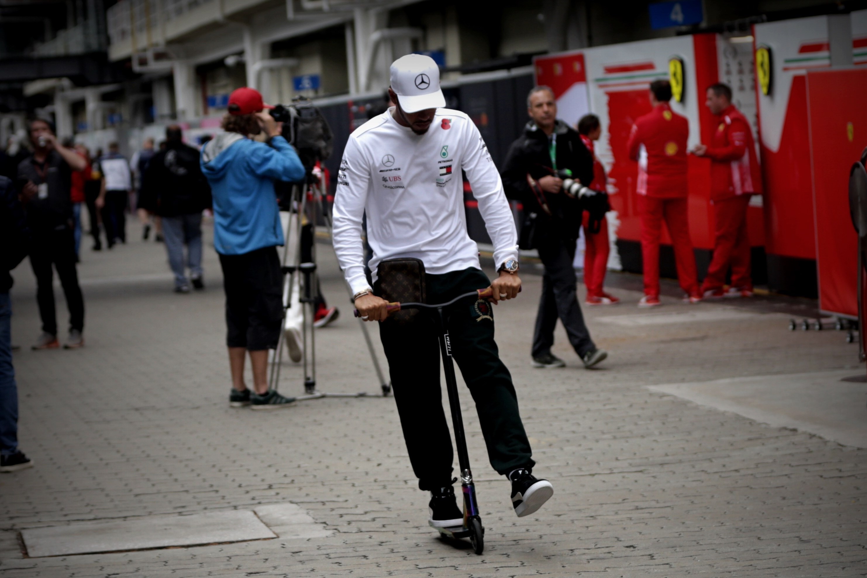 epa07150878 British driver Lewis Hamilton of Mercedes rides a scooter after a press conference at the Interlagos racetrack, where the Brazil Formula One Grand Prix will be celebrated next Sunday, in Sao Paulo, Brazil, 08 November 2018. EPA-EFE/FERNANDO BIZERRA