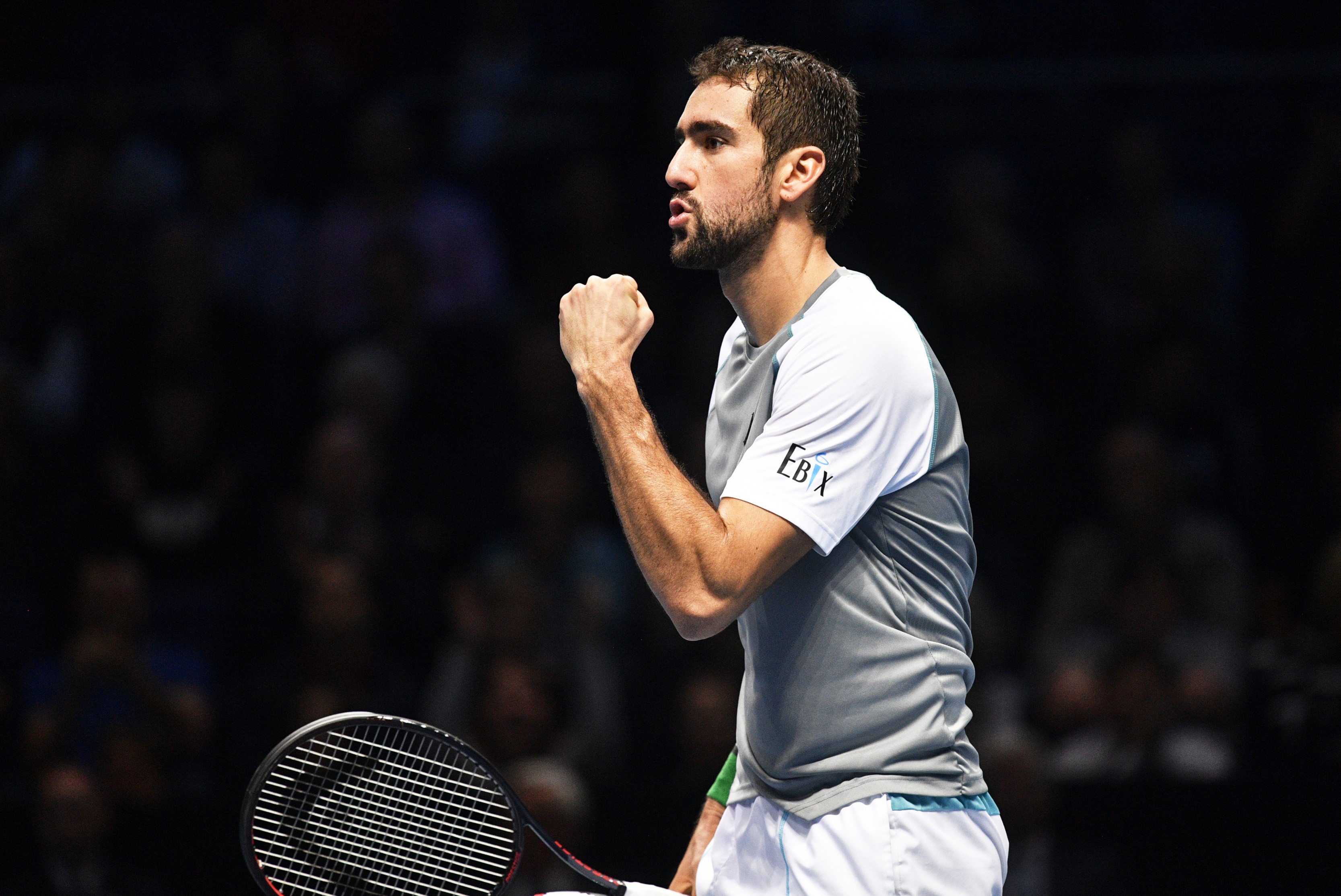 epa07165707 Croatia's Marin Cilic reacts during his round robin match against John Isner of the USA at the ATP World Tour Finals tennis tournament in London, Britain, 14 November 2018. EPA-EFE/NEIL HALL