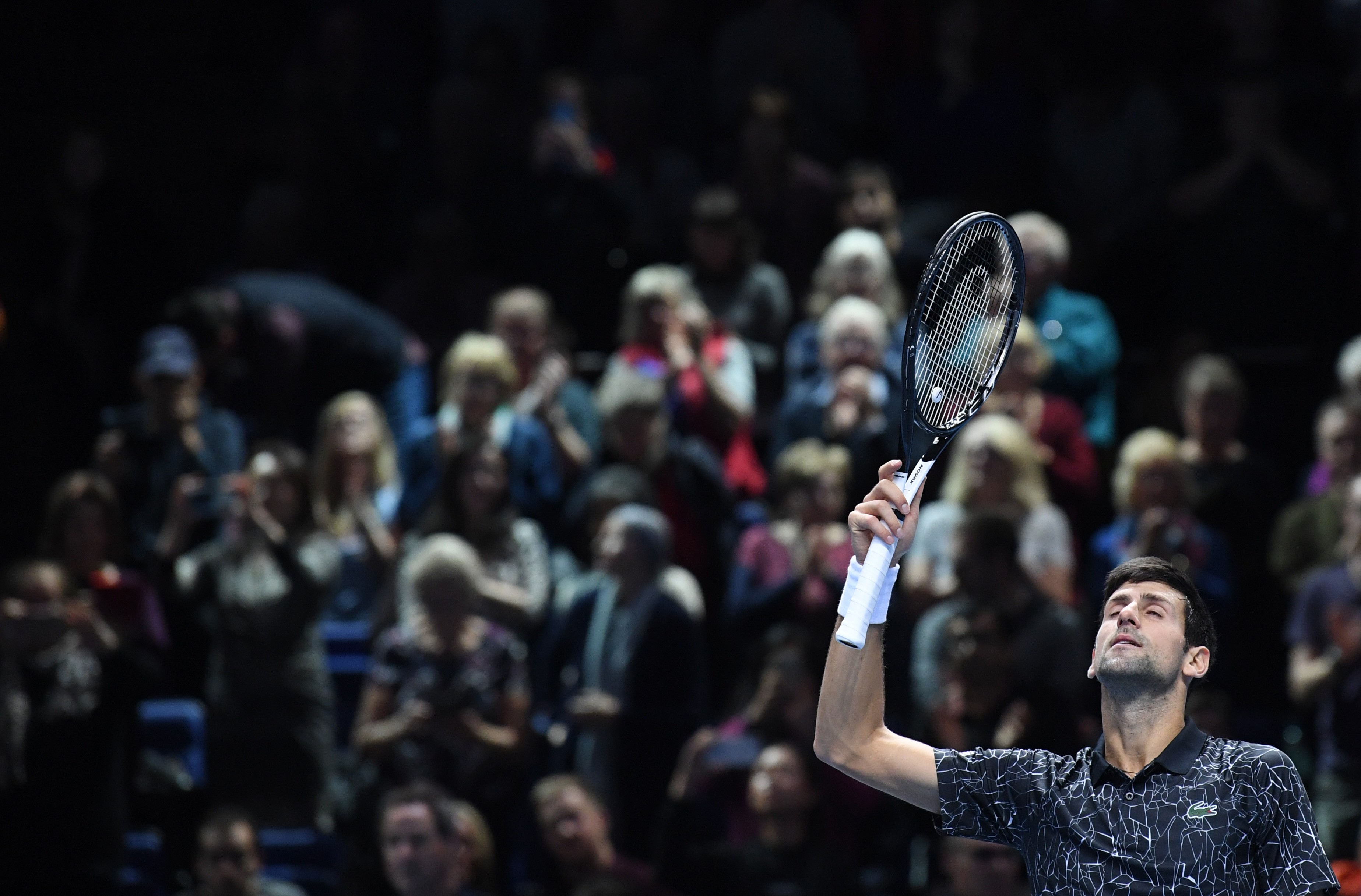 epa07165134 Serbia's Novak Djokovic celebrates winning his round-robin tennis match against Germany's Alexander Zverev of the ATP World Tour Finals tennis tournament at the O2 Arena in London, Britain, 14 November 2018. EPA-EFE/NEIL HALL
