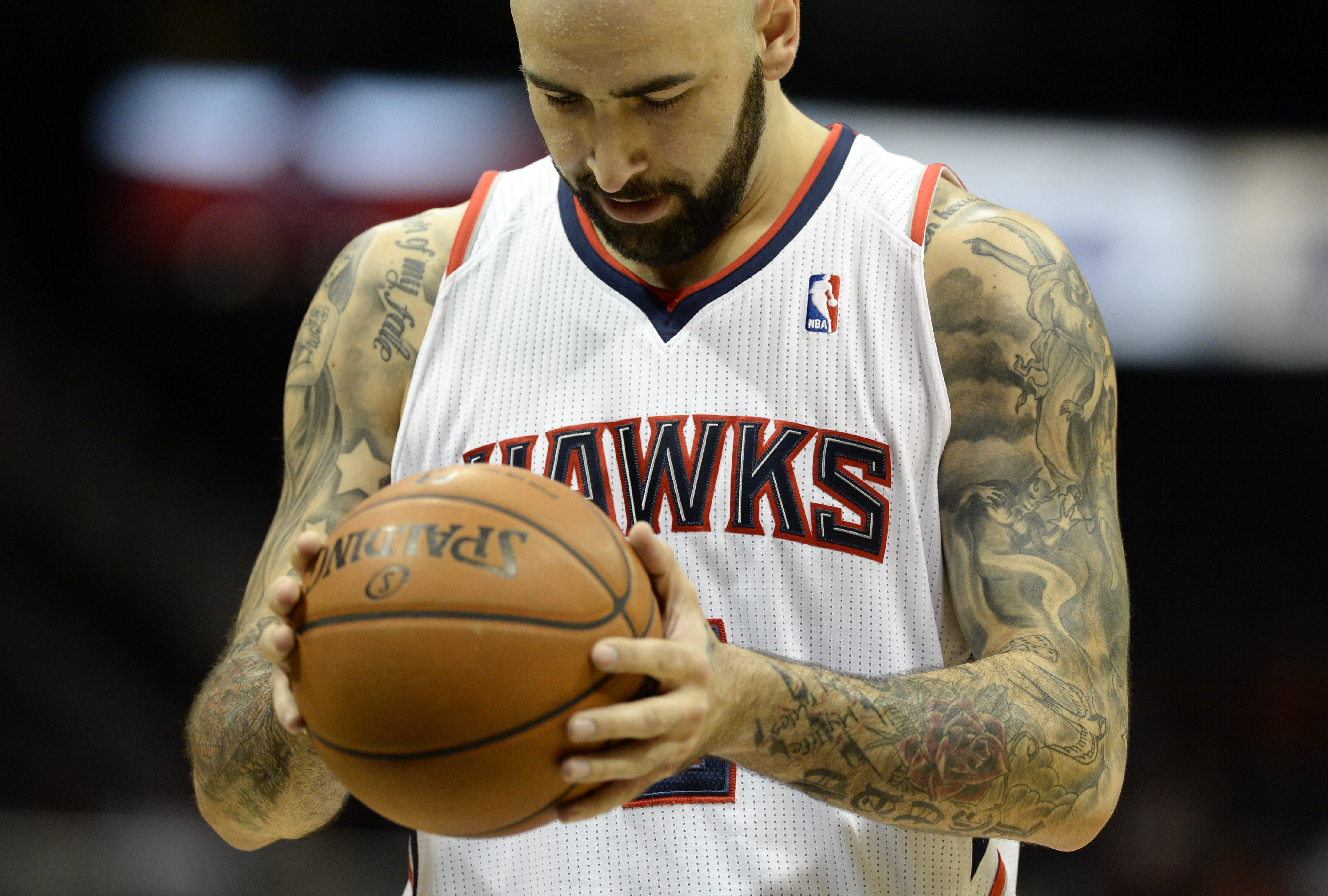 epa03966815 Atlanta Hawks forward Pero Antic of Macedonia pauses before attempting a free throw against the Orlando Magic during the second half of their NBA basketball game at Philips Arena in Atlanta, Georgia, USA, 26 November 2013. The Magic defeated the Hawks. EPA/ERIK S. LESSER CORBIS OUT