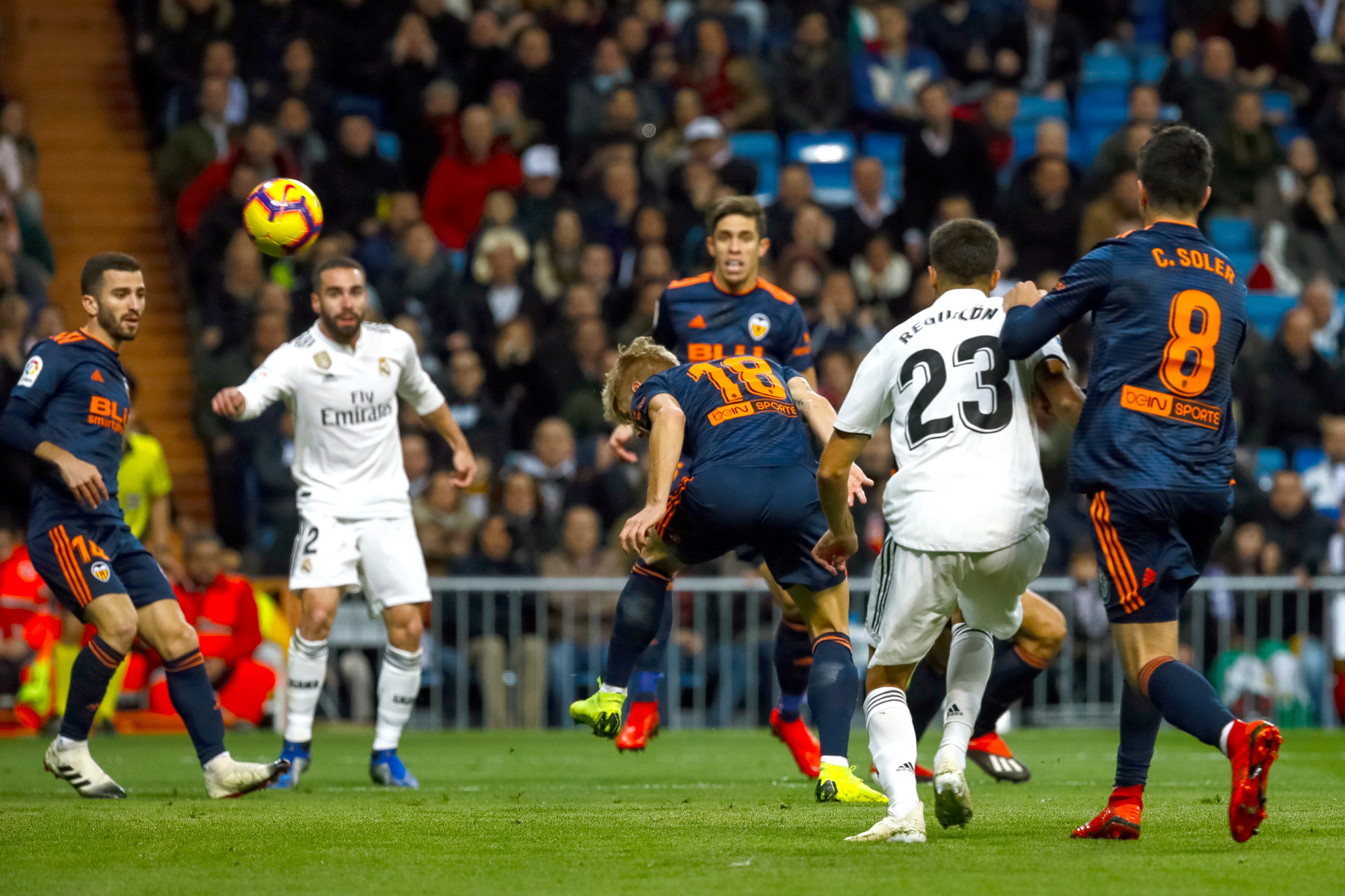 epa07202622 Valencia CF's Danish Daniel Wass (C) scores in his own goal during their Spanish Liga Primera Division soccer match played at Santiago Bernabeu stadium in Madrid, Spain, 01 December 2018. EPA-EFE/Emilio Naranjo