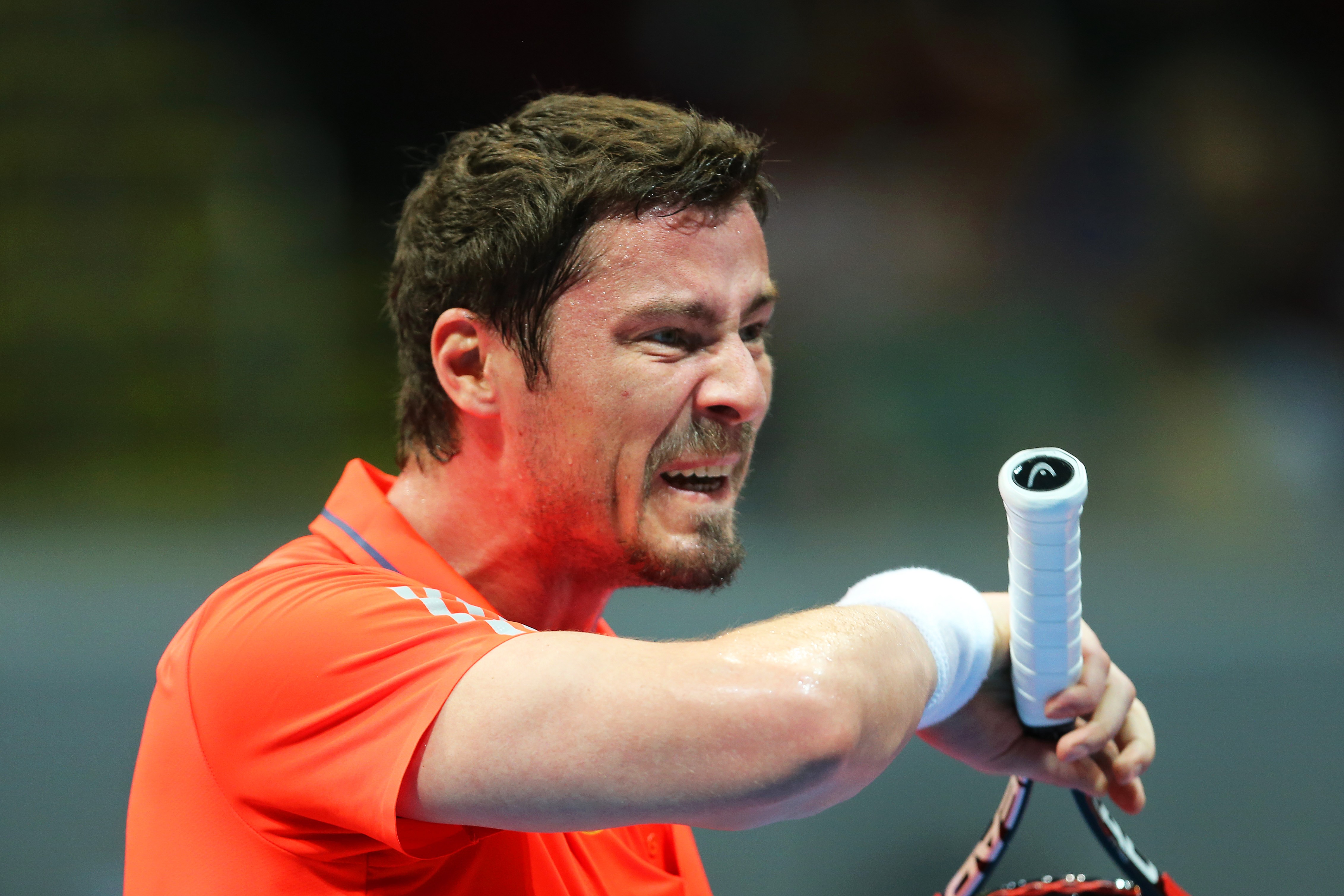 epa05056568 Russia's Marat Safin of the Japan Warriors reacts during his men's singles match against Spain's Carlos Moya of the Singapore Slammers at the second leg of the International Premier Tennis League (IPTL) at the Mall of Asia Arena in Pasay city, south of Manila, Philippines, 06 December 2015. The IPTL features five teams made out of a hybrid mix of current and former tennis players. EPA/MARK R. CRISTINO
