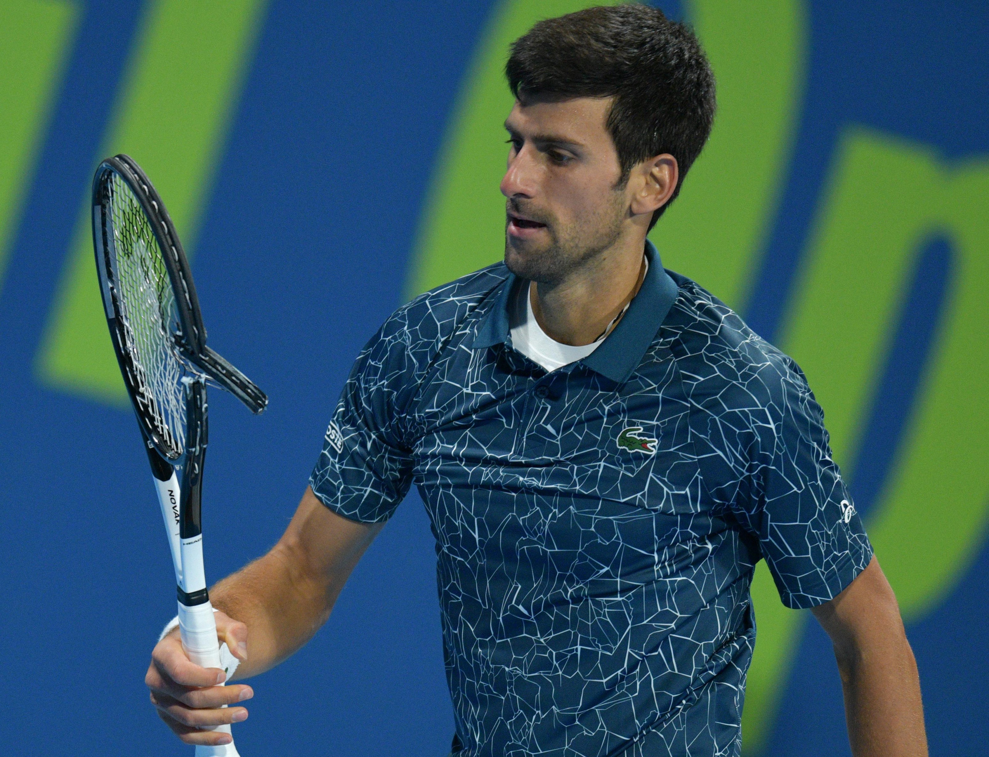 epa07262193 Novak Djokovic of Serbia in action against Roberto Bautista Agut of Spain during their semi final match of the ATP Qatar Open Tennis tournament at the Khalifa International Tennis Complex in Doha, Qatar, 04 January 2019. EPA-EFE/NOUSHAD THEKKAYIL