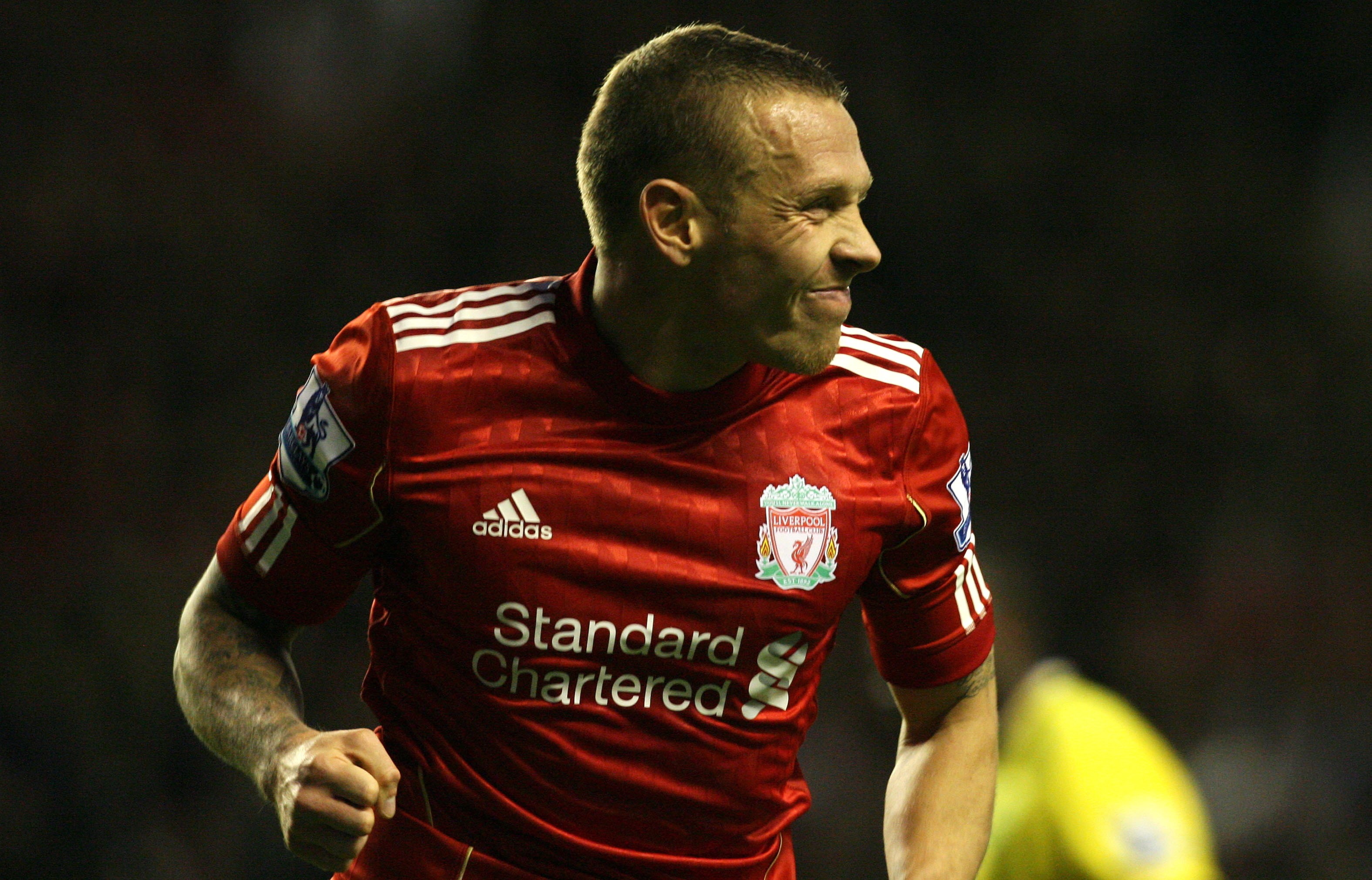 epa02976773 Liverpool's Craig Bellamy celebrates after scoring the 1-0 lead against Norwich City during the English Premier League soccer match at the Anfield stadium in Liverpool, north west Britain, 22 October 2011. EPA/LINDSEY PARNABY DataCo terms and conditions apply http//www.epa.eu/downloads/DataCo-TCs.pdf